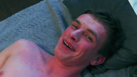 Shy dude with a bubble pooper getting poked on a bed