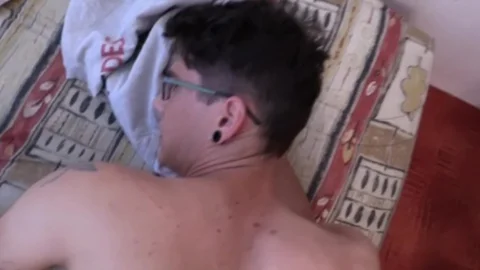 A nice-looking boy takes his raiment off